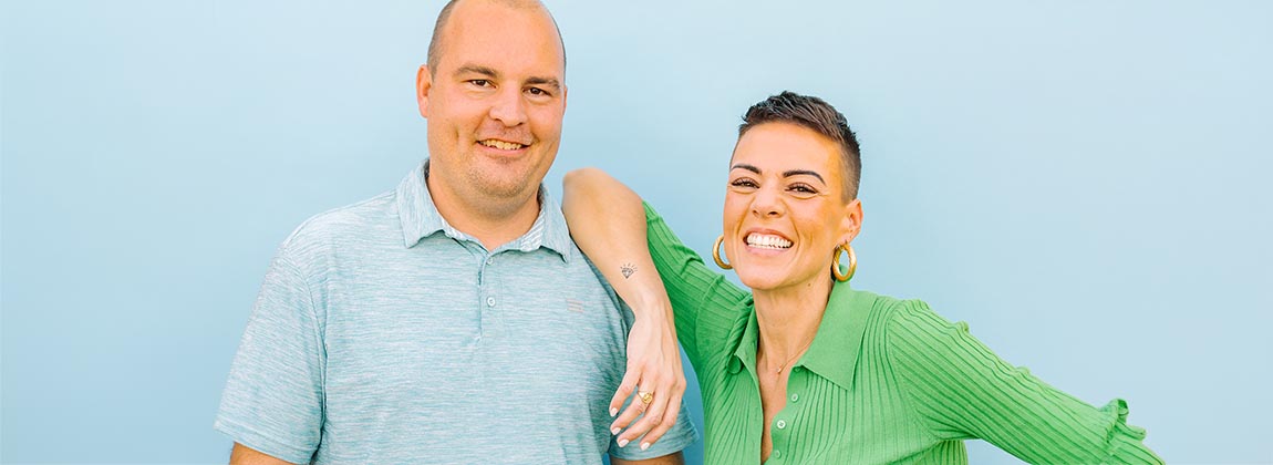 A man and woman smiling for a photo